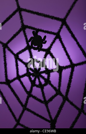 Silhouette of spider on purple background Stock Photo