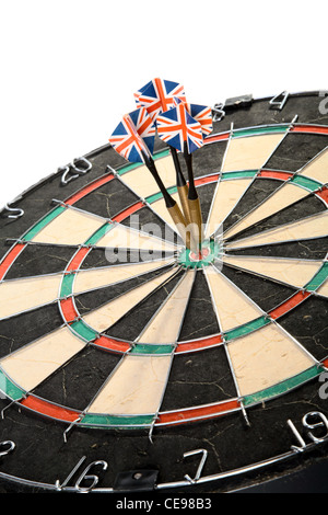 Three Darts Arrows Poked Right In The Center Stock Photo