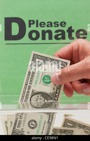 USA, Illinois, Metamora, Man's hand giving donation Stock Photo