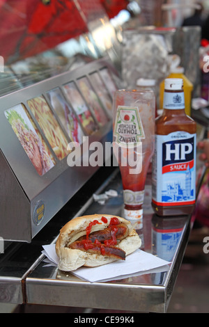 sandwich sausage barm eating on the street Stock Photo