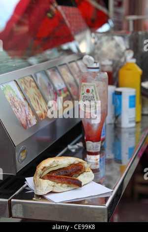 sandwich sausage barm eating on the street Stock Photo