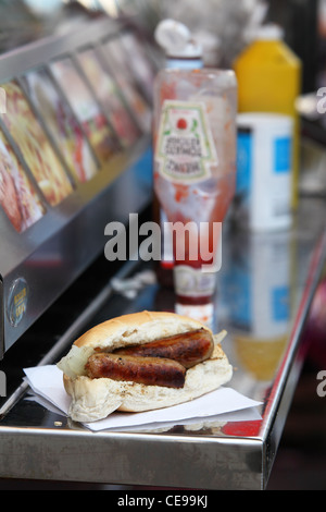 sandwich sausage barm eating on the street Stock Photo