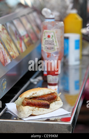 sandwich sausage barm eating on the street Stock Photo