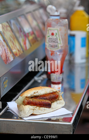 sandwich sausage barm eating on the street Stock Photo