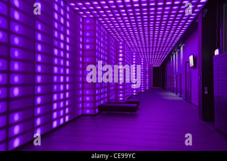 Purple coloured lights front of house entrancce to club room wall light lobby lighting Stock Photo