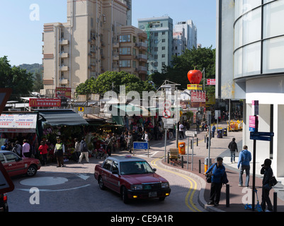 dh  STANLEY HONG KONG Red Taxi and Stanley Market stalls outdoor markets Stock Photo