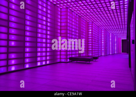 Purple coloured lights front of house entrancce to club room lobby lighting Stock Photo