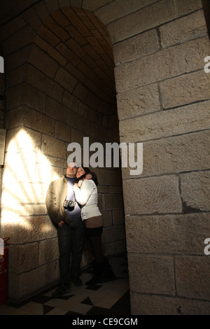 lovers alone in the stone space of an old castle Stock Photo
