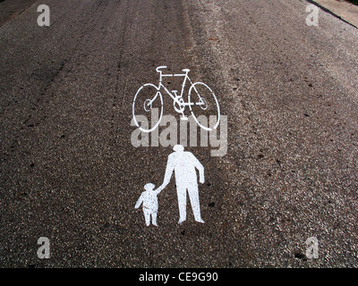 Sign painted on the road or asphalt pavement indicating a bicycle path Stock Photo