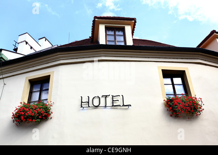 Wall of hotel close-up with windows and singboard Stock Photo