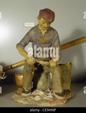 Figurine depicting a carder at the 17th and 18th centuries. Sabadell History Museum. Catalonia. Spain. Stock Photo