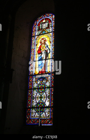 Stained glass, religious scenes, Abbey Church of St. Pierre, Beaulieu sur Dordogne, France Stock Photo