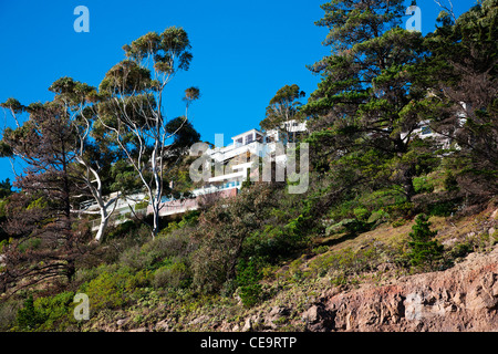 Houses on the edge of the cliff tops at Sumner, Christchurch, Canterbury, South Island, New Zealand. NZ Stock Photo