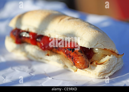 sandwich sausage barm eating on the street Stock Photo