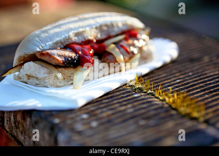 sandwich sausage barm eating on the street Stock Photo