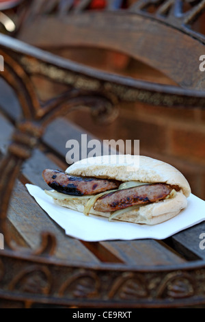 sandwich sausage barm eating on the street Stock Photo