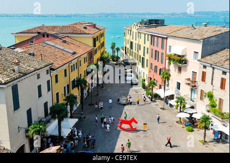 The holiday resort town of Sirmione on Lake Garda, Lombardy, Italy. From the castle over Piazza Castello to Lago di Garda Stock Photo
