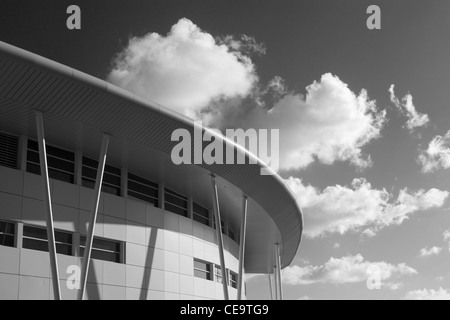 Modern building detail on a background of a sky with puffy clouds. Juliana International Airport SXM, Sint Maarten, WI. BW photo Stock Photo
