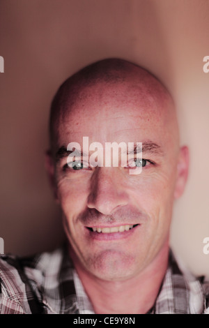 Portrait of Caucasian man with shaved head. Stock Photo