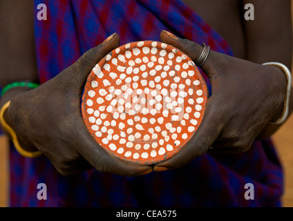 Mursi Man Holding Clay Lip Plate With White Dots In His Hands Ethiopia Stock Photo