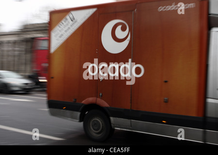 an Ocado van traveling along a road in London Stock Photo