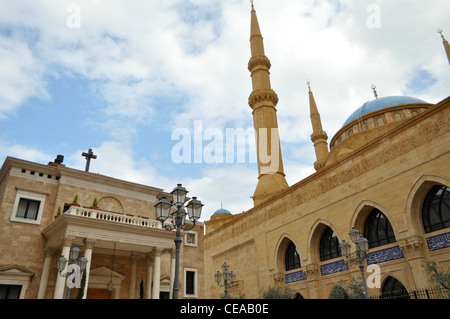 Saint George Maronite Cathedral and Mohammad Al-Amin Mosque sit side by side in Beirut's central district Stock Photo