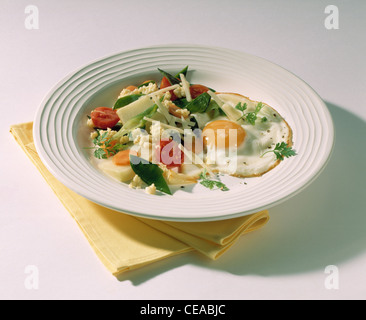 Vegetable pan with millet and fried egg Stock Photo