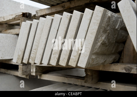 Concrete slabs and paving stones for sale at a builders merchants. Stock Photo