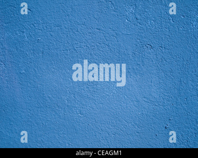 Textured azure blue cement or stucco wall. Stock Photo