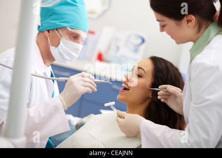 Pretty patient undergoing a dental check Stock Photo