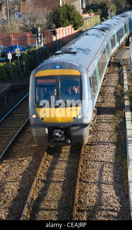 Diesel train and carriages railway lines approaching Woodbridge, Suffolk, England Stock Photo