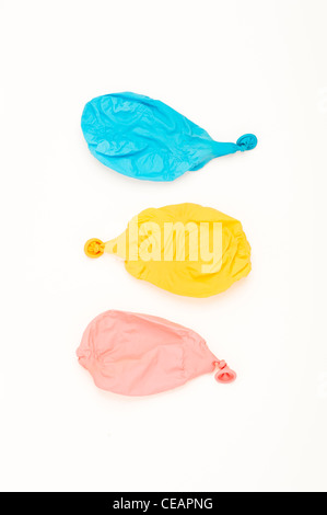 Three deflated balloons Stock Photo