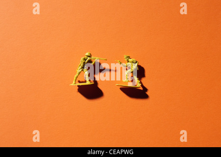 Two toy soldiers on orange background Stock Photo