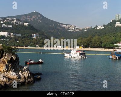 dh  DEEP WATER BAY HONG KONG Chinese boat in anchorage beach luxury motor boat Stock Photo