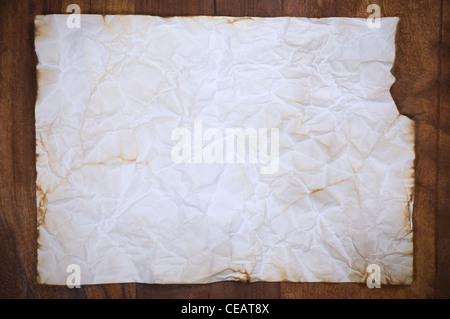 Old paper sheet on wooden background Stock Photo