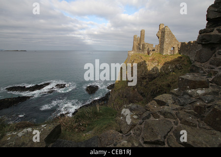 Rugged coast Northern Ireland. The ruins of Dunluce Castle Co Antrim Northern Ireland overlooking the Atlantic Ocean and Causeway Coast. Stock Photo