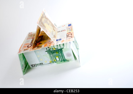 House made of Euro currency portraying the economic crisis and fragility in the eurozone during 2012. Stock Photo