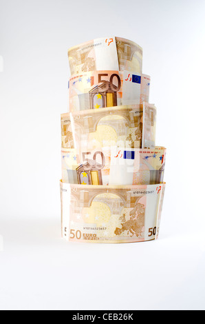 Tower made of Euro currency portraying the economic crisis and fragility in the eurozone during 2012 Stock Photo