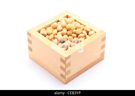 Soybeans in the wooden square cup on white background Stock Photo