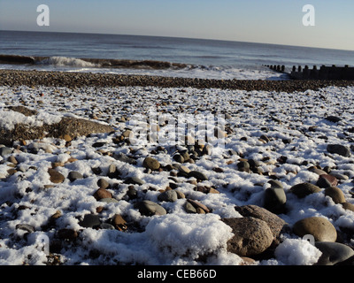 Beach in snow at Hornsea, UK, a lovely town along Yorkshire Coast . Landscape dated 2012 January. Stock Photo