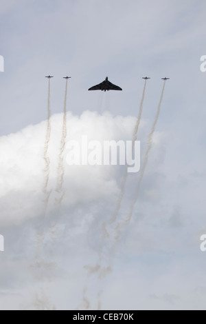 The Blades perform a flypast with the visiting Avro Vulcan B2, Sywell, Northamptonshire, UK Stock Photo