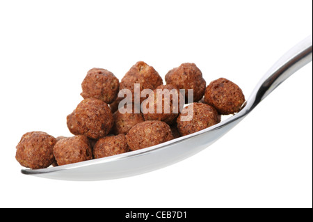 Chocolate cornflakes. A dry breakfast in a spoon. It is isolated on a white background Stock Photo