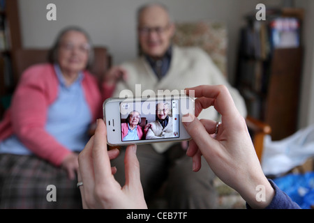 Using technology with different generations Stock Photo - Alamy