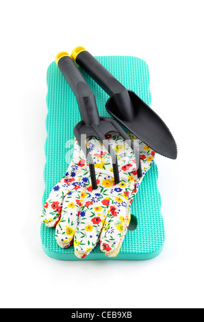 Kneeling pad, gloves and hand gardening tools on white background in vertical format Stock Photo