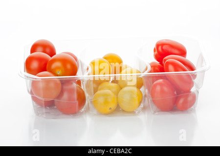 Multicolored cherry tomatoes in a bowl isolated on white background Stock Photo