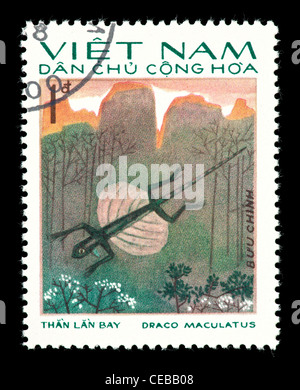 Postage stamp from Vietnam depicting a spotted flying dragon (Draco maculatus) Stock Photo