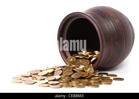 Golden coins falling out from pot on white background Stock Photo