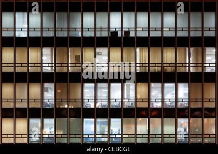 The grid windows of the CIS Tower offices located on Miller Street, Manchester, taken at night. Stock Photo