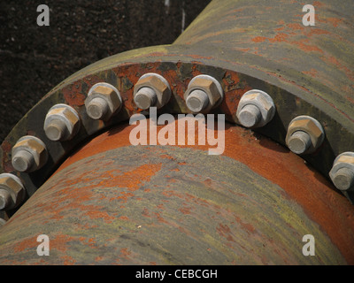 Nuts and bolts holding industrial sized water pipes together Stock Photo