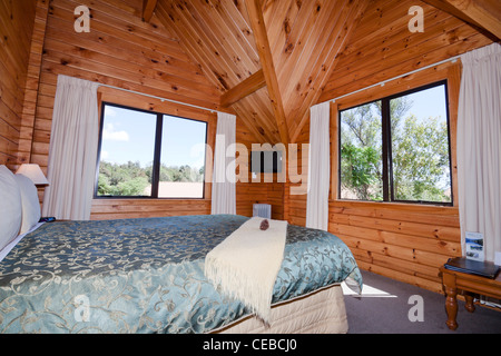 Nice warm interior of mountain wooden lodge apartment. Fox Glacier Lodge, Fox Glacier, West Coast, South Island, New Zealand. Stock Photo